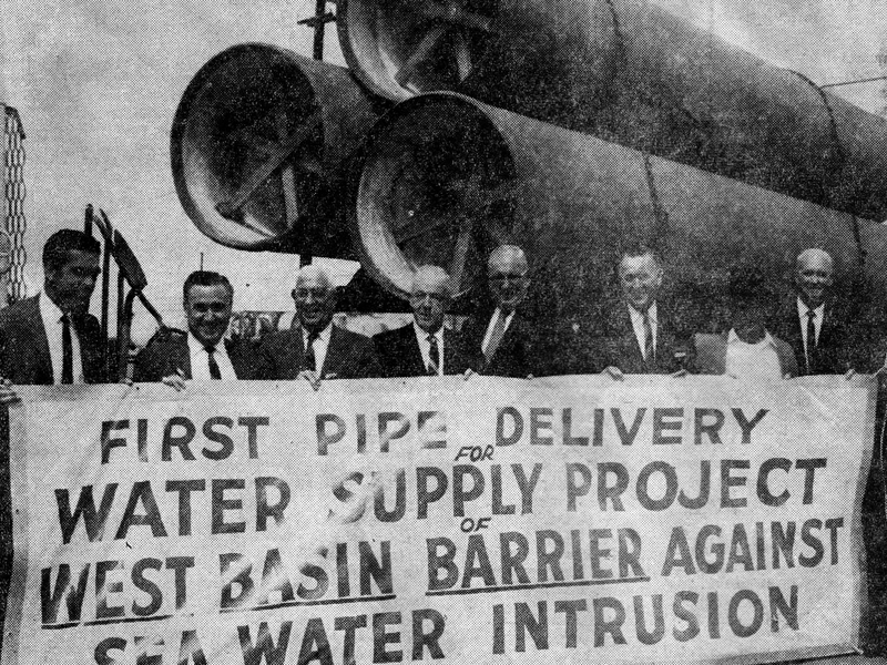 Historical photo of first pipe delivery for Water Supply Project